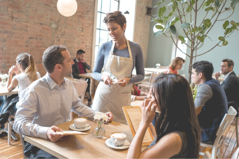 Friendly restaurant scene to illustrate Confero's work in the restaurant and hospitality industries.